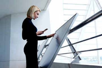 Woman using a touchscreen LED screen