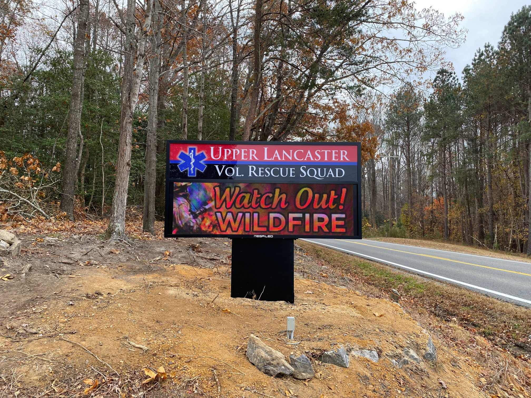 LED digital sign for Upper Lancaster Volunteer Rescue Squad displaying wildfire warning message along a roadside