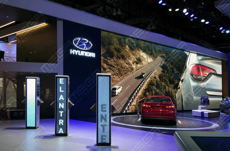 Large LED video wall displaying automotive visuals at a Hyundai booth in showroom environment