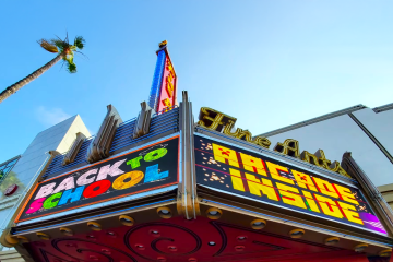 LED marquee sign at a movie theater in Los Angeles displaying showtimes and film promotions on a digital display