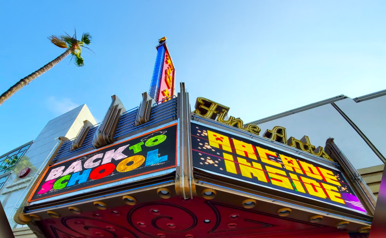 LED marquee sign at a movie theater in Los Angeles displaying showtimes and film promotions on a digital display