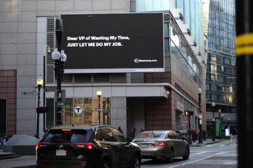 Outdoor digital billboard in a city promoting retail products and brand advertising on a wall mounted screen